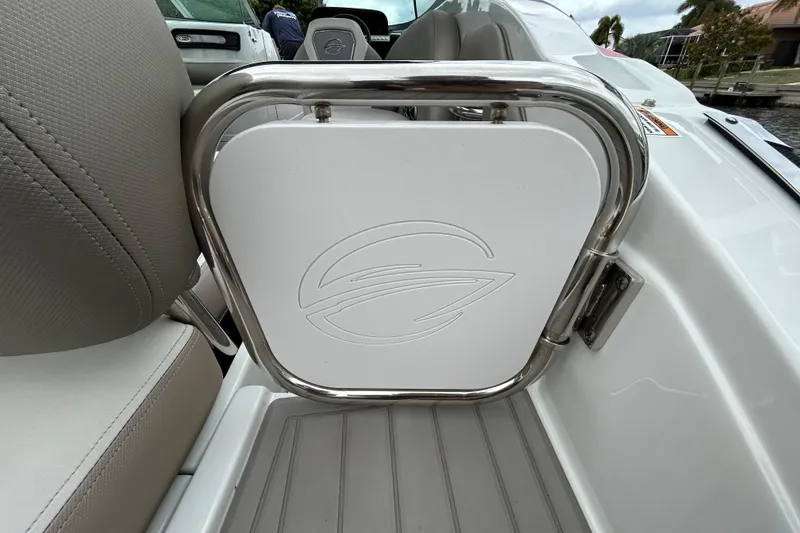 Slide: The Image of 2022 Crownline 270 XSS boat interior with logo on white panel and stainless steel frame. - 57
