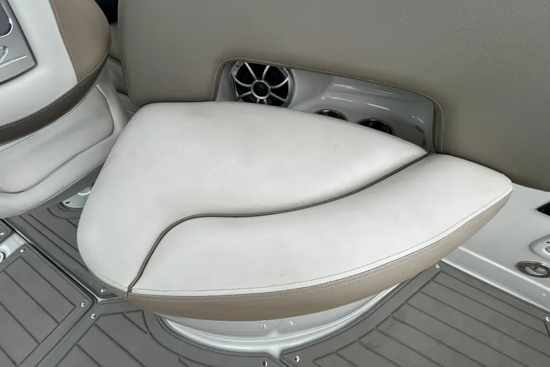 Slide: The Image of Crownline 270 XSS 2022 boat interior seating with speaker and cup holders. - 59