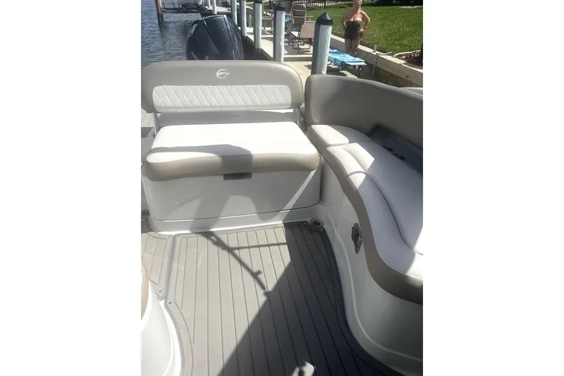 Slide: The Image of 2022 Crownline 270 XSS boat interior with cushioned seating and sleek design. - 6