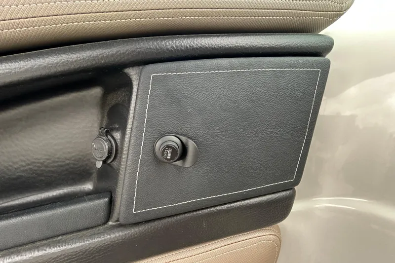 Slide: The Image of Control panel of a 2022 Crownline 270 XSS boat with voltage relay and windlass switch. - 70