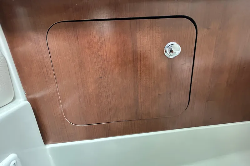 Slide: The Image of 2022 Crownline 270 XSS boat bathroom with modern sink, granite countertop, and compact toilet. - 76