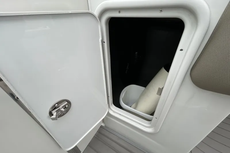 Slide: The Image of Steering wheel and dashboard of 2022 Crownline 270 XSS boat, featuring modern controls and displays. - 80