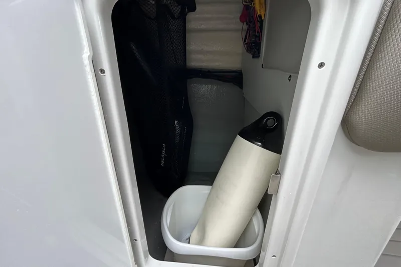 Slide: The Image of 2022 Crownline 270 XSS boat dashboard with steering wheel and navigation displays. - 81