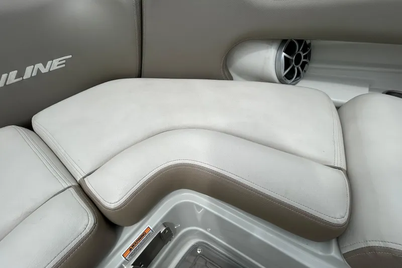 Slide: The Image of Control panel of a 2022 Crownline 270 XSS boat with safety warnings. - 87