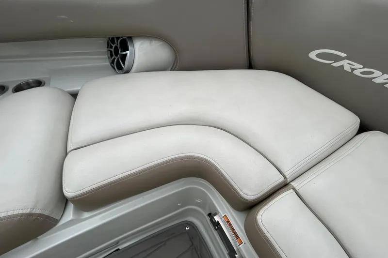Slide: The Image of Storage compartment in a 2022 Crownline 270 XSS boat with fender and netting. - 90