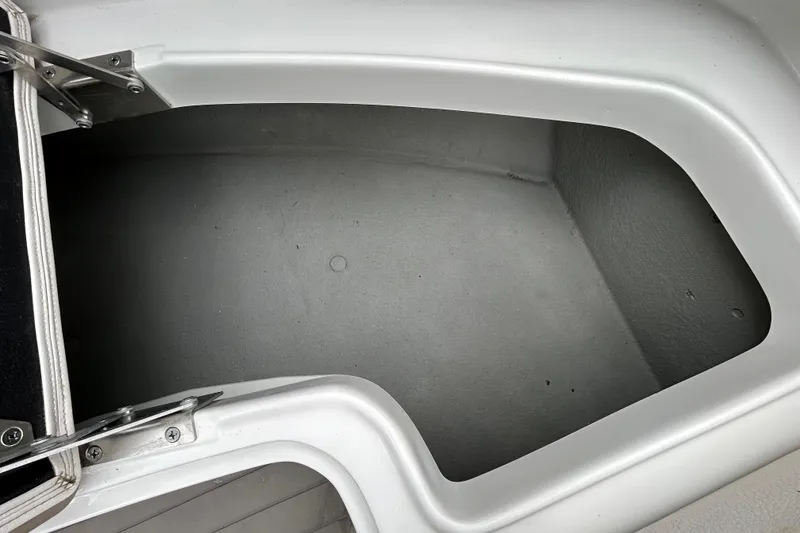 Slide: The Image of 2022 Crownline 270 XSS boat interior with sleek design and waterfront view. - 92