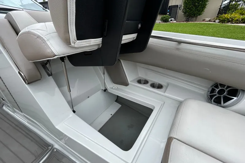 Slide: The Image of Close-up of a black mesh funnel with a handle, part of a 2022 Crownline 270 XSS. - 95