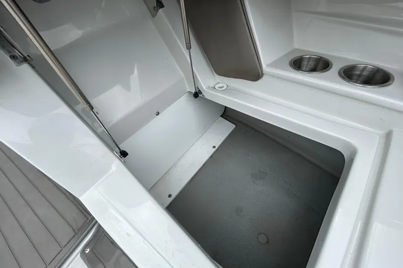 Slide: The Image of 2022 Crownline 270 XSS boat seat with diamond-stitched upholstery and armrest. - 96
