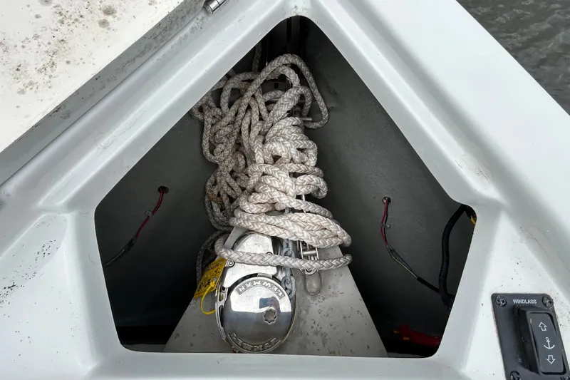 Slide: The Image of Interior view of 2022 Crownline 270 XSS boat showing storage compartment and seating. - 99