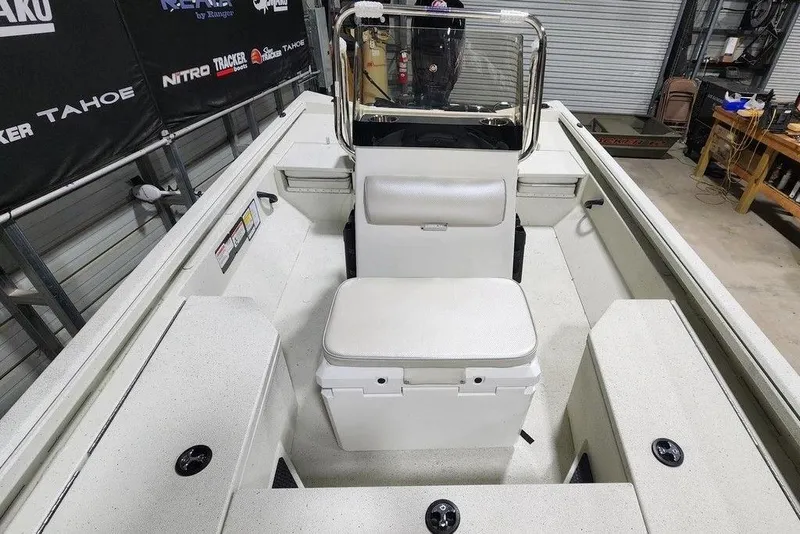 Slide: The Image of 2026 Ranger RB190 boat interior with seating and console in a garage setting. - 12