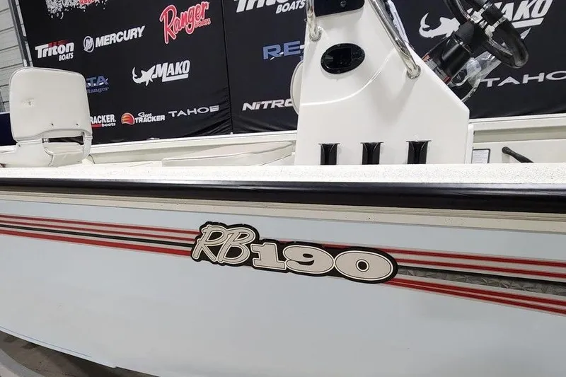 Slide: The Image of 2026 Ranger RB190 boat displayed at a marine exhibition with branded backdrop. - 13