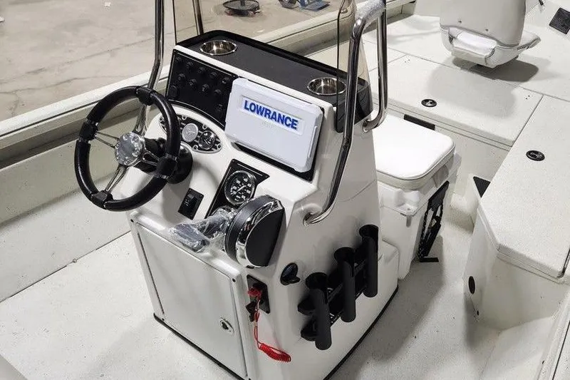 Slide: The Image of 2026 Ranger RB190 boat console with steering wheel, Lowrance electronics, and cup holders. - 5