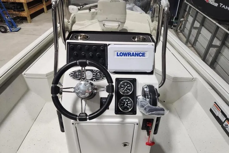 Slide: The Image of 2026 Ranger RB190 boat console with steering wheel, gauges, and Lowrance Elite system. - 7