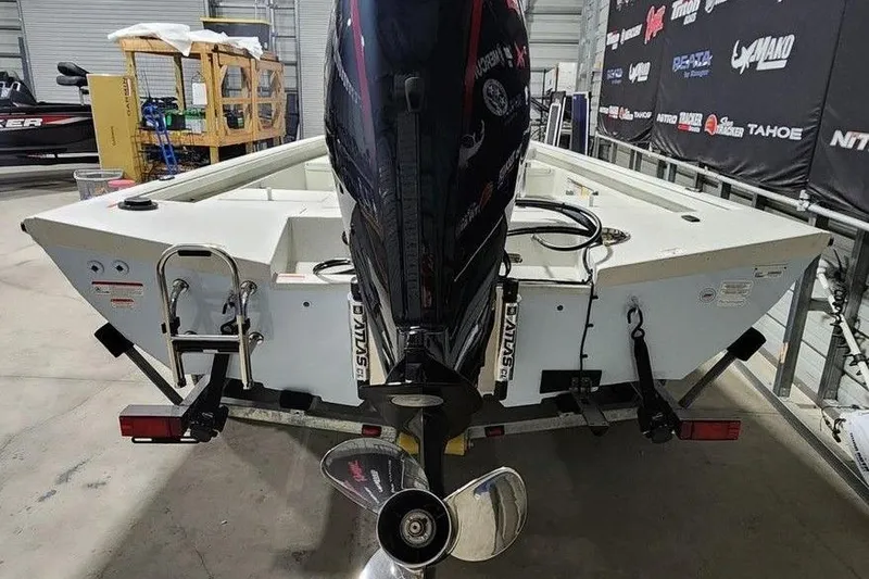 Slide: The Image of 2026 Ranger RB190 boat with outboard motor in a showroom setting. - 8