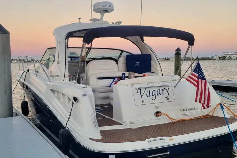 Slide: The Image of 2005 Sea Ray 390 Sundancer boat docked at sunset with American flag. - 3