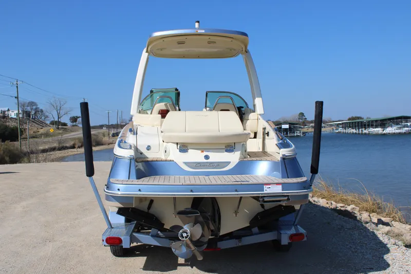 Slide: The Image of 2025 Chris Craft Launch 28 GT boat on trailer by waterfront. - 4