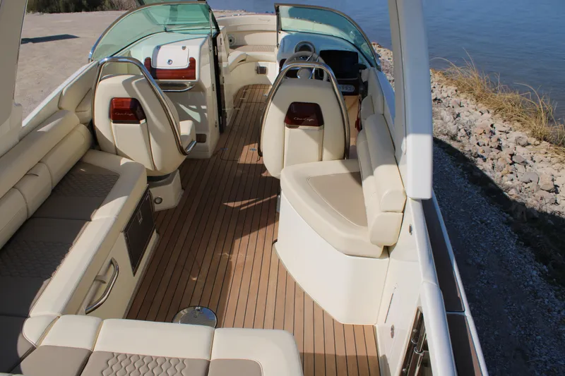 Slide: The Image of 2025 Chris Craft Launch 28 GT interior with luxurious seating and wooden deck. - 8