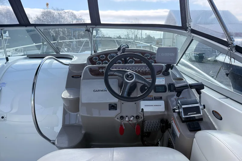 Slide: The Image of Cockpit of 2002 Maxum 3100 SE boat with Garmin navigation system and Mercury controls. - 7