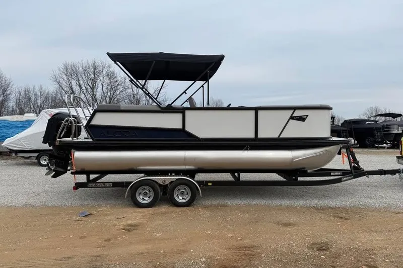 The Image of 2026 Alara 22Q pontoon boat on trailer, parked outdoors. - 0