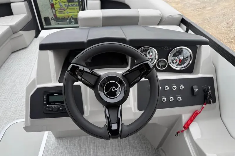 Slide: The Image of Steering console of 2026 Alara 22Q boat with modern controls and gauges. - 10