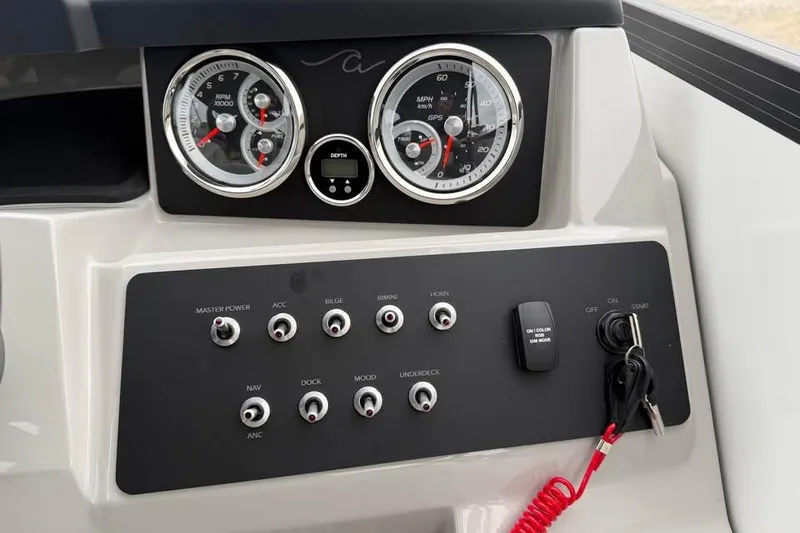 Slide: The Image of Control panel of 2026 Alara 22Q boat with gauges and switches. - 11