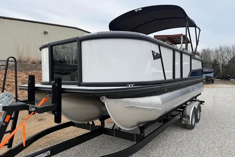Slide: The Image of 2026 Alara 22Q pontoon boat on trailer, featuring sleek design and canopy. - 3