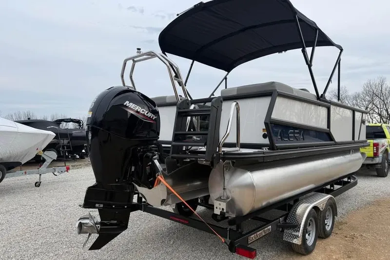 Slide: The Image of 2026 Alara 22Q pontoon boat with Mercury outboard motor on a trailer. - 5