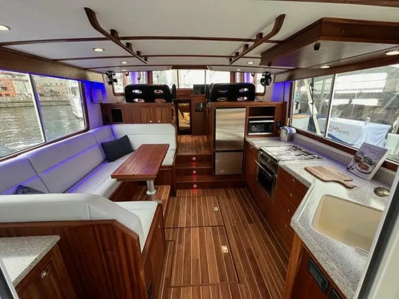 Slide: The Image of Luxurious interior of 2024 Nordic Tug 40 with modern kitchen and seating area. - 2
