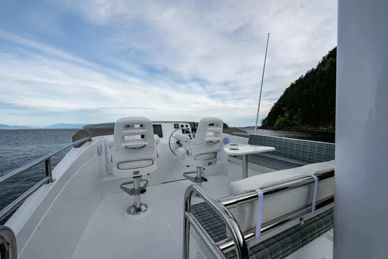 Slide: The Image of 2024 Nordic Tug 40 boat deck with seating and ocean view. - 21