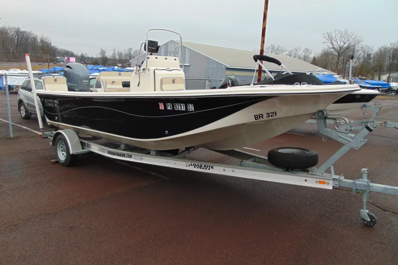 The Image of 2020 Carolina Skiff 21 LS boat on trailer in outdoor setting. - 1