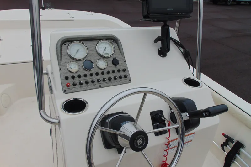 Slide: The Image of 2020 Carolina Skiff 21 LS boat console with steering wheel and gauges. - 10