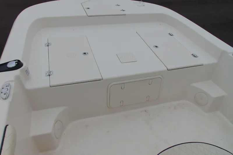 Slide: The Image of 2020 Carolina Skiff 21 LS boat deck with storage compartments and clean design. - 11