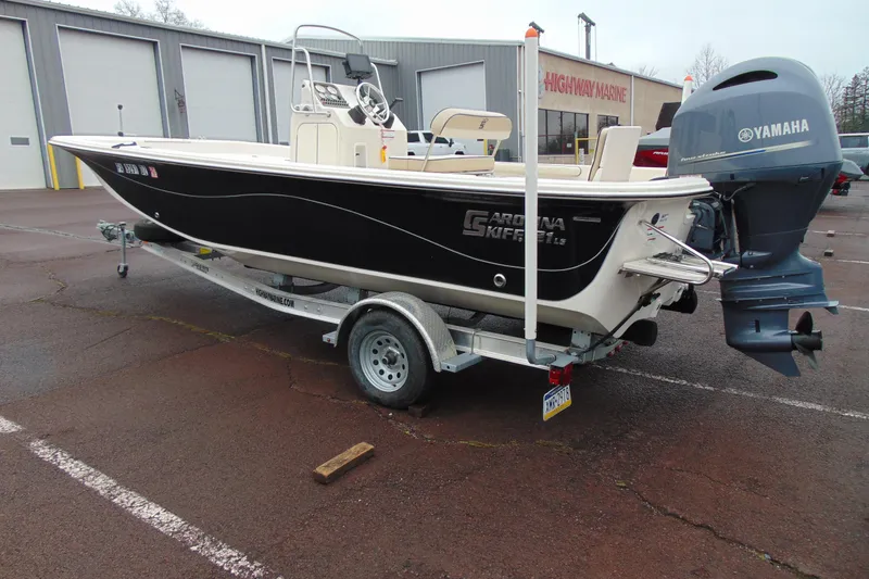 Slide: The Image of 2020 Carolina Skiff 21 LS boat with Yamaha engine on trailer in parking lot. - 3