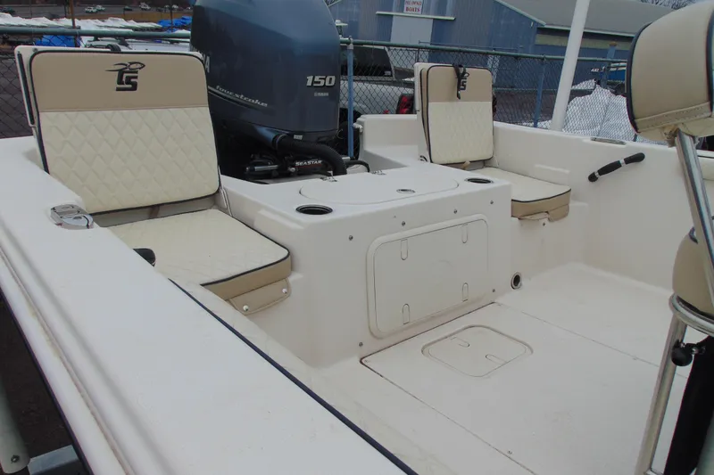 Slide: The Image of 2020 Carolina Skiff 21 LS boat interior with seating and Yamaha 150 engine. - 5