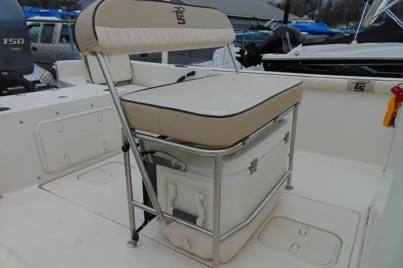 Slide: The Image of 2020 Carolina Skiff 21 LS boat interior with cushioned seating and storage. - 6