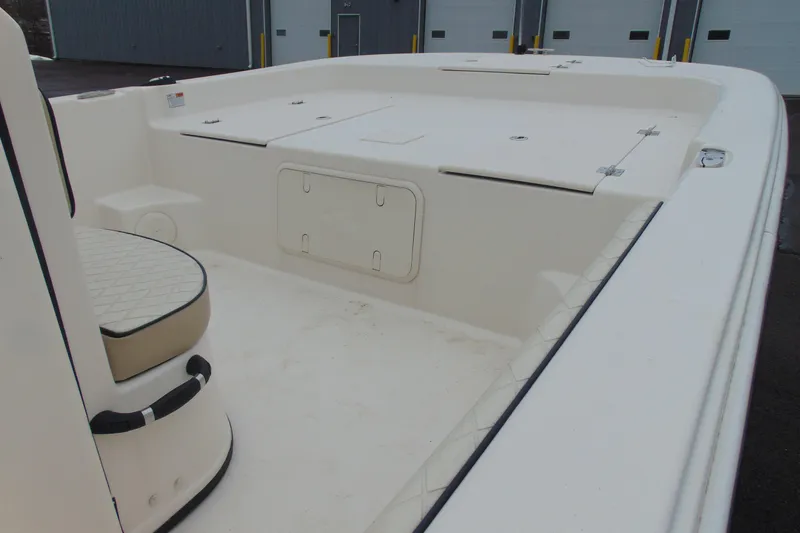 Slide: The Image of 2020 Carolina Skiff 21 LS boat interior with seating and storage compartments. - 7