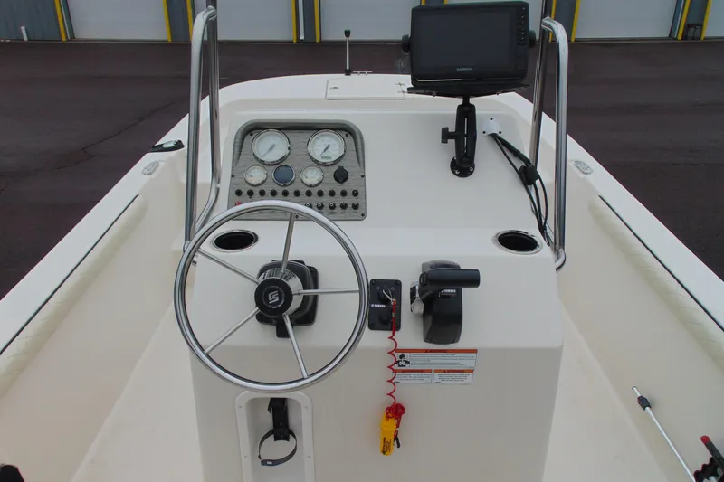 Slide: The Image of 2020 Carolina Skiff 21 LS boat console with steering wheel and navigation equipment. - 9