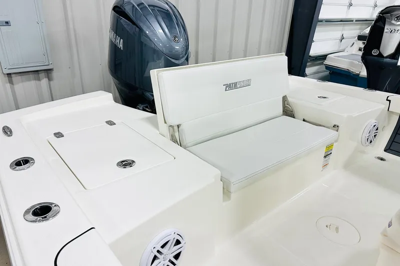 Slide: The Image of 2026 Pathfinder 2200 TRS boat interior with Yamaha engine, featuring seating and storage compartments. - 13