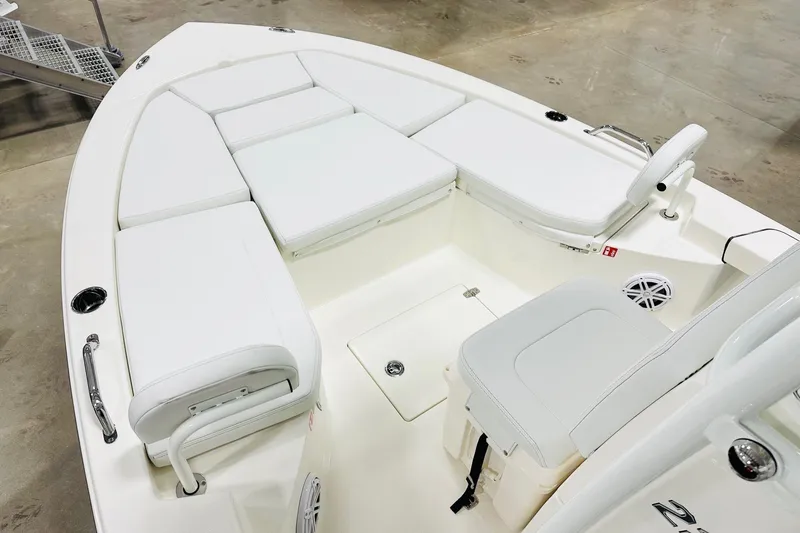 Slide: The Image of 2026 Pathfinder 2200 TRS boat interior with white seating and storage compartments. - 9