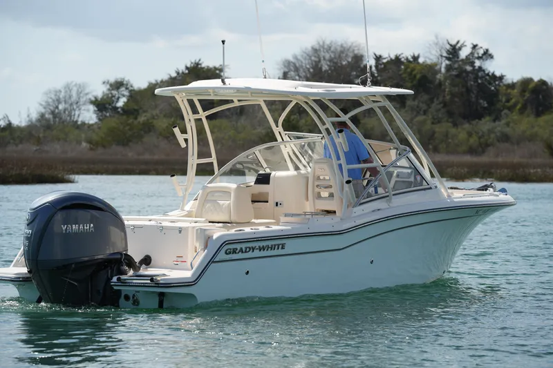 Slide: The Image of 2021 Grady-White Freedom 235 boat with Yamaha engine on calm water. - 17