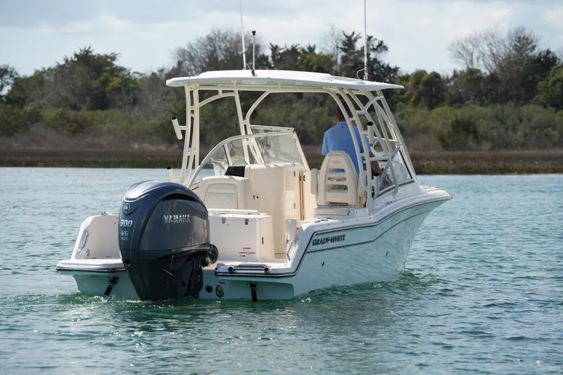 Slide: The Image of 2021 Grady-White Freedom 235 boat with Yamaha engine on calm water. - 18