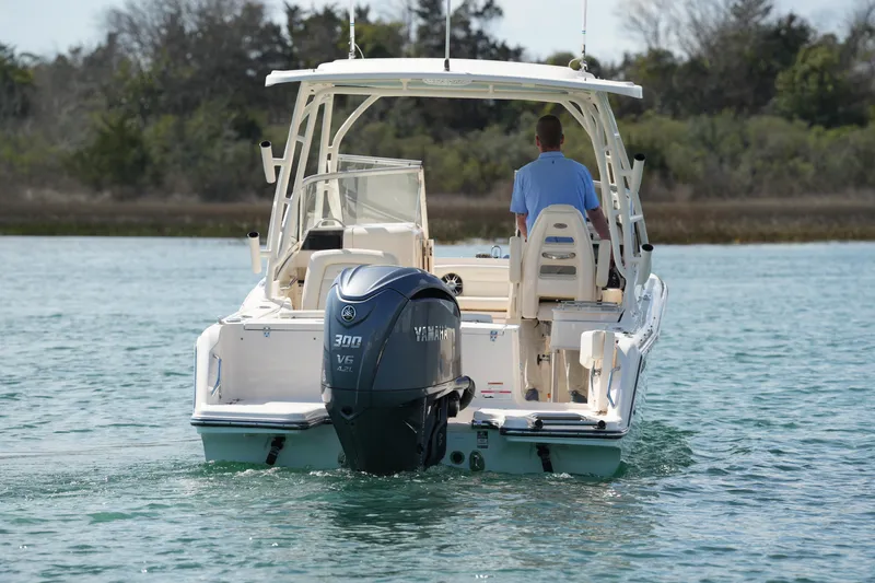 Slide: The Image of 2021 Grady-White Freedom 235 boat with Yamaha 300 V6 engine on calm water. - 19