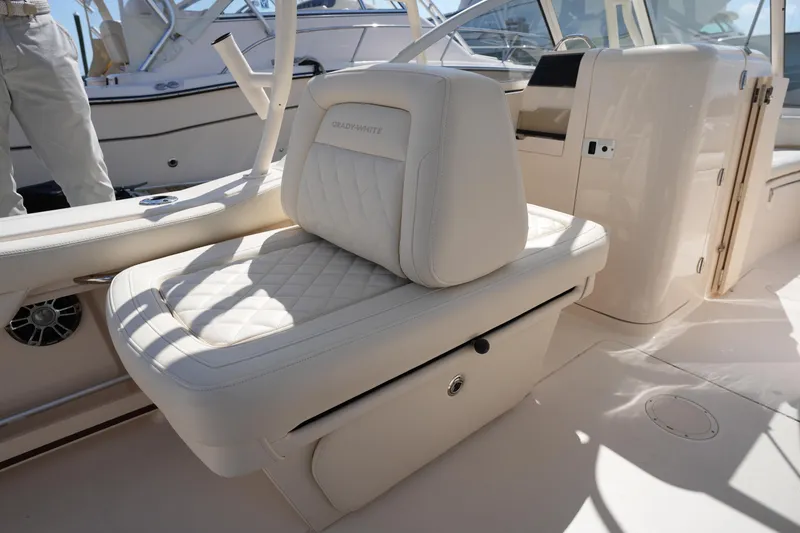 Slide: The Image of 2021 Grady-White Freedom 235 boat interior with luxurious seating and storage. - 22