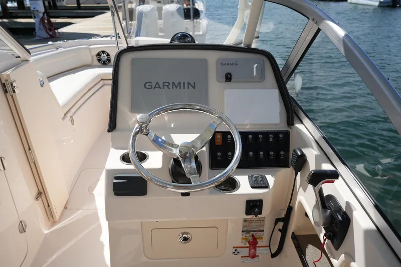Slide: The Image of 2021 Grady-White Freedom 235 boat helm with Garmin navigation system. - 28