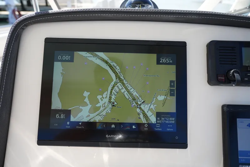 Slide: The Image of Garmin navigation display on 2021 Grady-White Freedom 235 boat dashboard. - 32