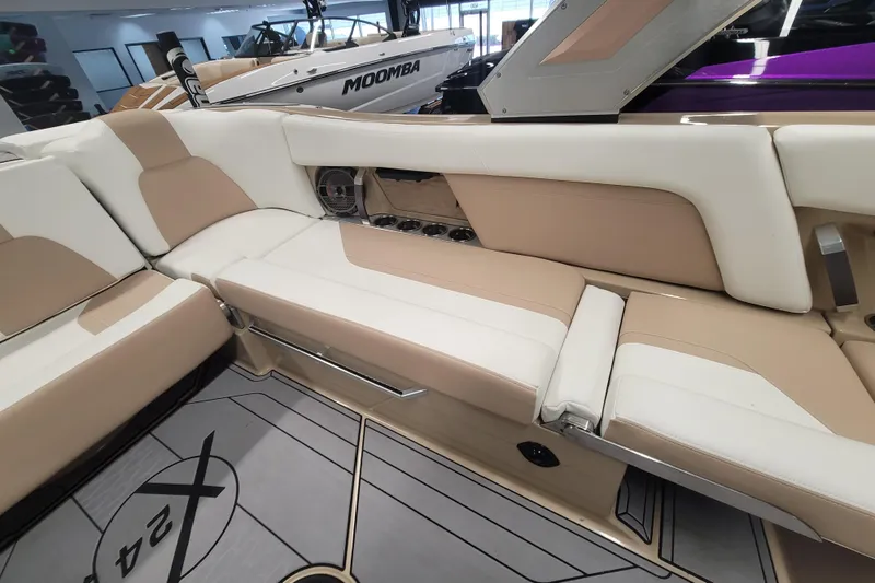 Slide: The Image of Luxurious interior of 2022 MasterCraft X24 boat with beige and white seating. - 10