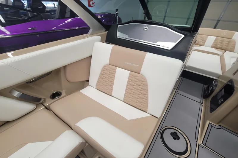 Slide: The Image of 2022 MasterCraft X24 interior with beige and white seating, modern design. - 14