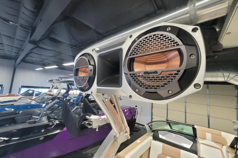 Slide: The Image of 2022 MasterCraft X24 boat with Klipsch speakers in a showroom. - 19