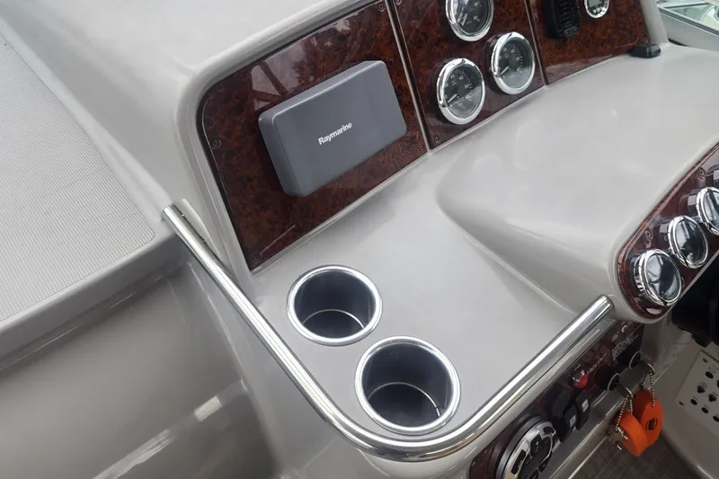 Slide: The Image of 2002 Formula 37 Performance Cruiser dashboard with gauges and cup holders. - 6