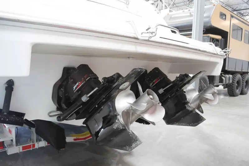 Slide: The Image of 2002 Formula 37 Performance Cruiser with dual propellers in a garage setting. - 7